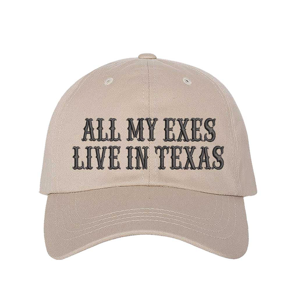 Stone All My Exes Live In Texas Embroidered Baseball Hat in cotton with pre-curved brim and adjustable hook and loop closure, styled for country music fans and Western trips. DSY Lifestyle.