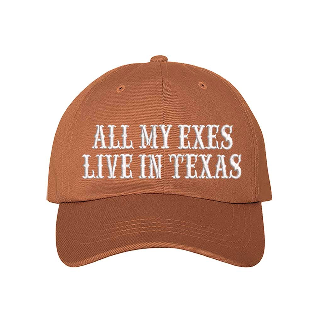 Texas Orange All My Exes Live In Texas Embroidered Baseball Hat in cotton with pre-curved brim and adjustable hook and loop closure, styled for country music fans and Western trips. DSY Lifestyle.