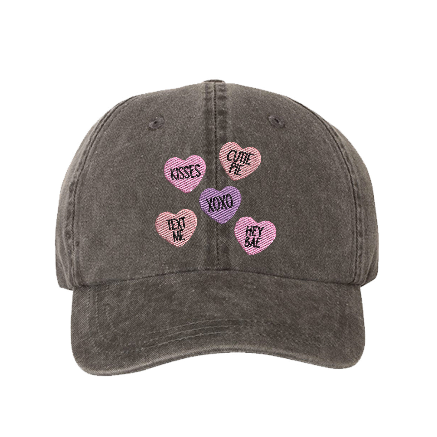 Black Candy Hearts Washed Baseball Hat featuring colorful pastel conversation heart embroidery on a vintage washed dad cap by DSY Lifestyle.