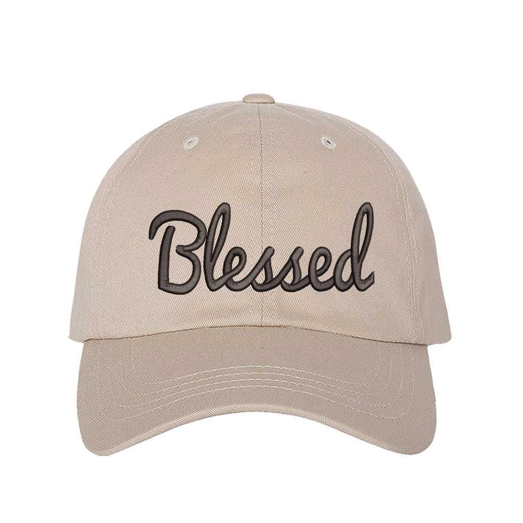 Stone detailed close-up of the premium black thread embroidery showing the clean lines of the word Blessed on a textured fabric. - DSY Lifestyle