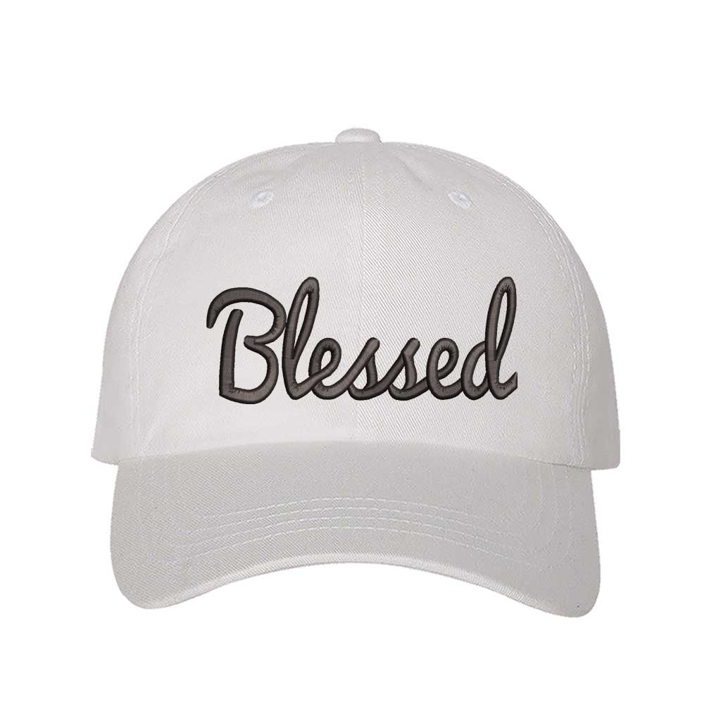 White detailed close-up of the premium black thread embroidery showing the clean lines of the word Blessed on a textured fabric. - DSY Lifestyle