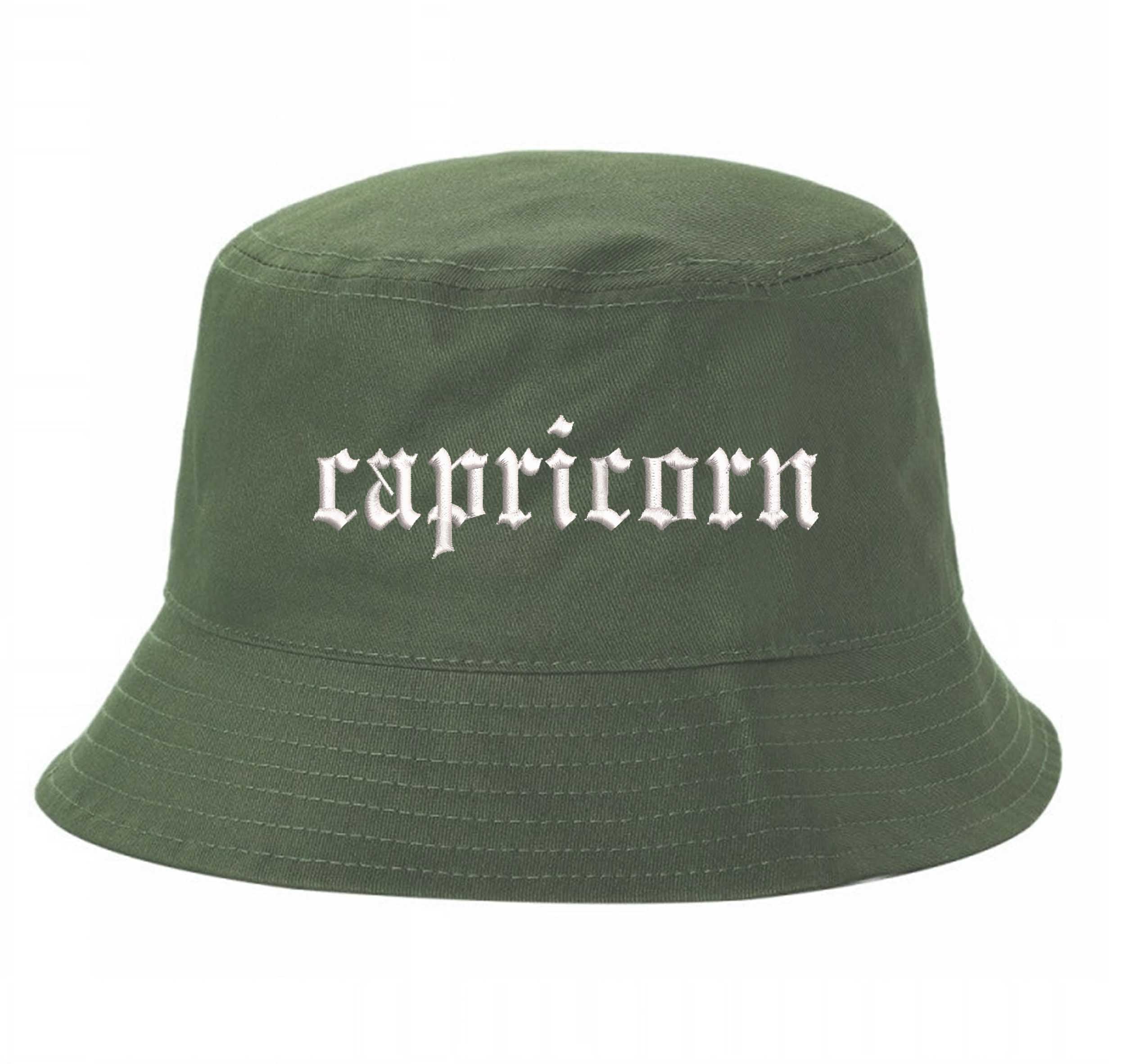 Olive Capricorn Bucket Hat, a zodiac statement hat for confident, grounded style with an effortless edge. DSY Lifestyle.