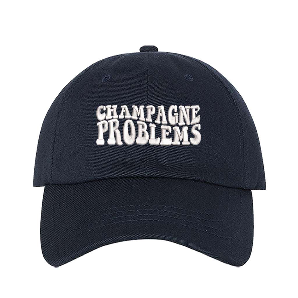 Navy baseball hat embroidered with the phrase champagne problems-DSY Lifestyle