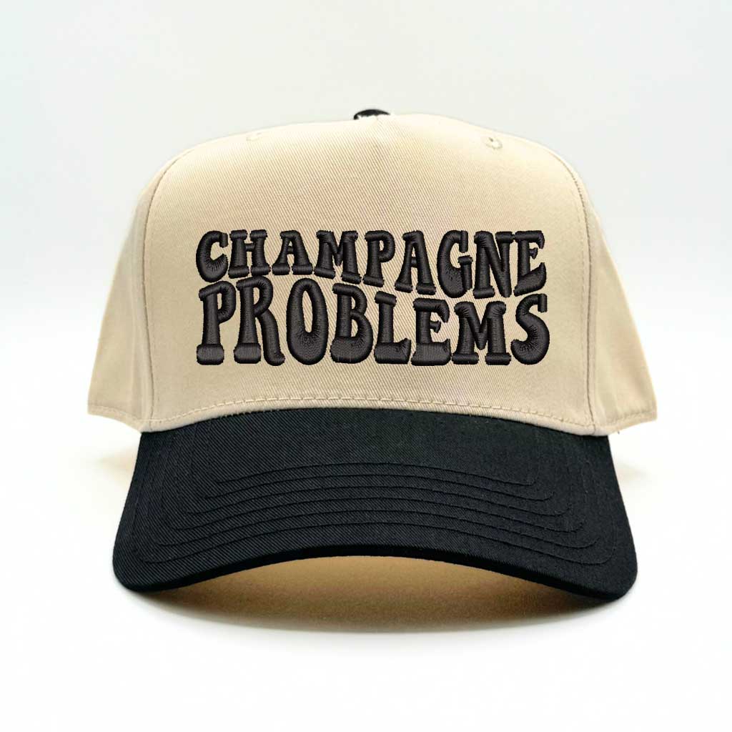 Natural color baseball hat with black bill and the phrase champagne problems in black embroidery-DSY Lifestyle