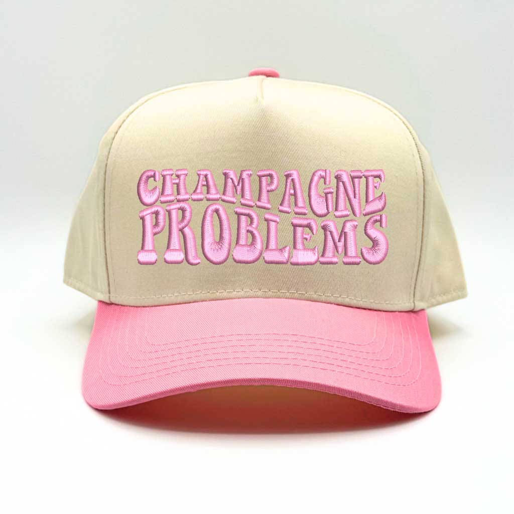 Natural color baseball hat with light pink bill and the phrase champagne problems in light pink embroidery-DSY Lifestyle