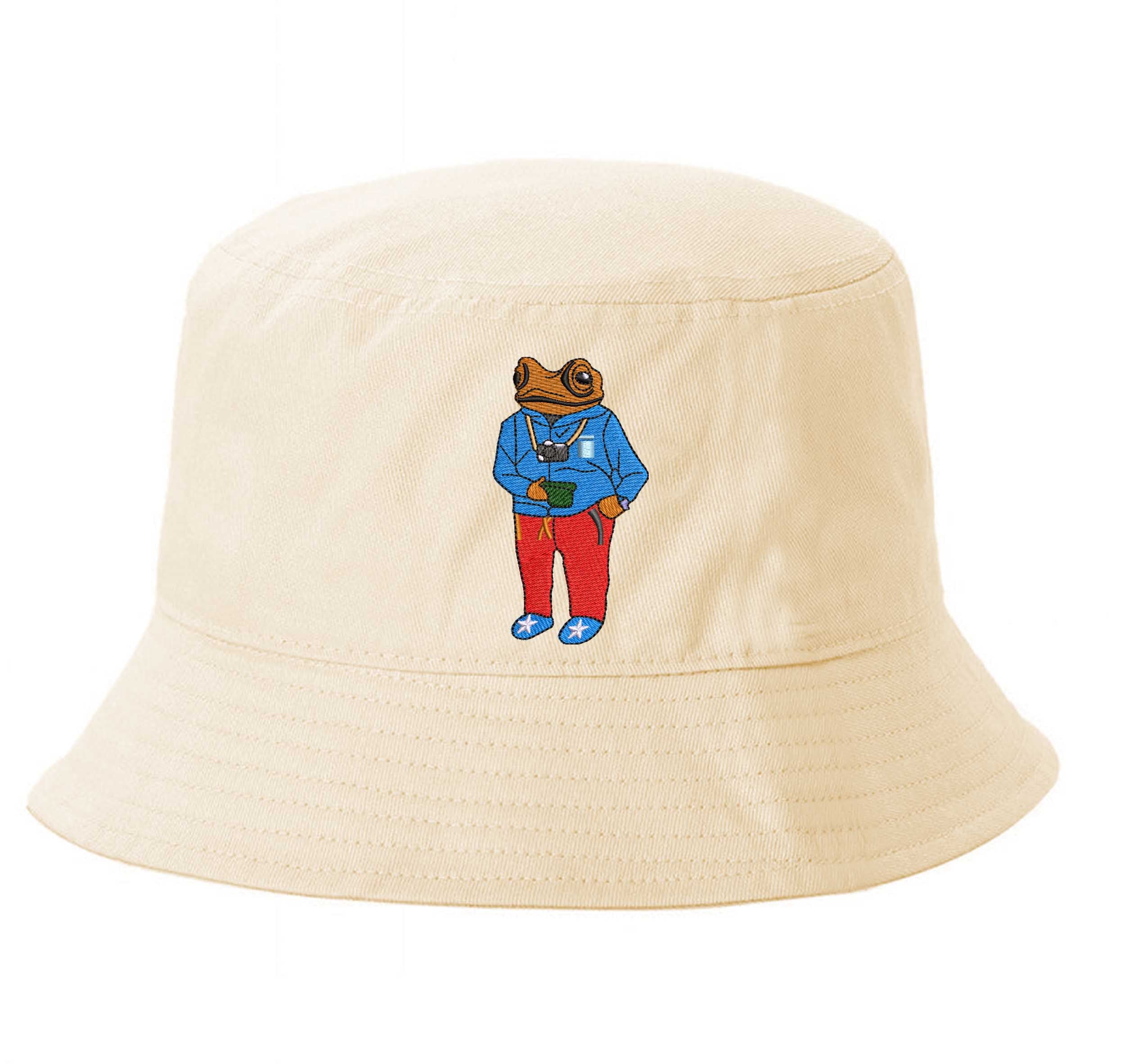 Stone Front view of a 100% cotton bucket hat featuring a detailed Sapo Concho (Puerto Rican Crested Toad) in high-density embroidery on the center. - DSY Lifestyle