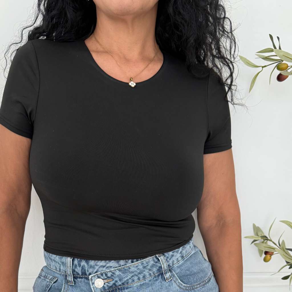 Close up of female wearing a crew neck double layer crop top in Black - DSY Lifestyle