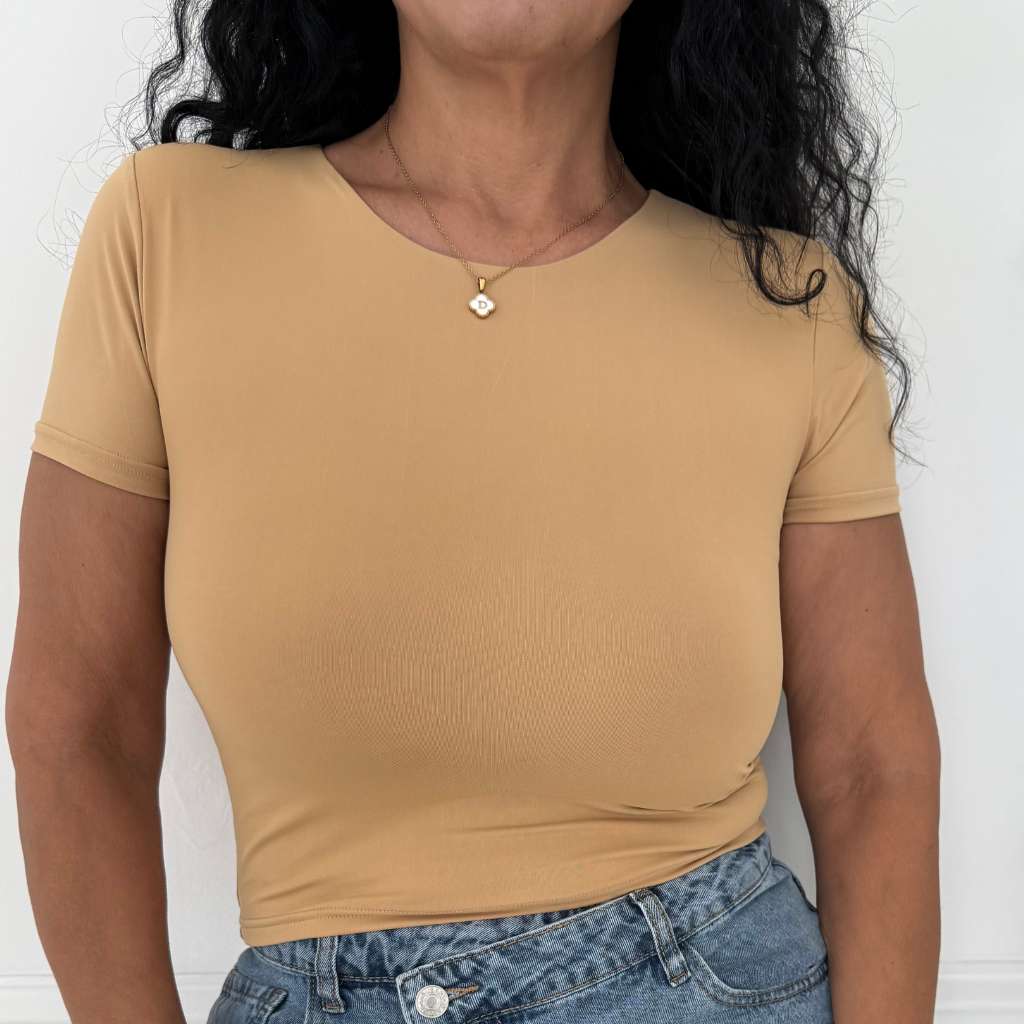 Close up of female wearing a crew neck double layer crop top in light tan - DSY Lifestyle