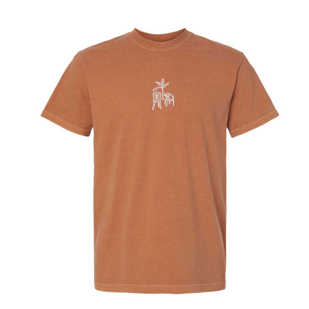 Yam brown Comfort Colors washed oversized t-shirt by DSY Lifestyle with a minimalist DTMF embroidery of a platano tree and two chairs centered on the chest.