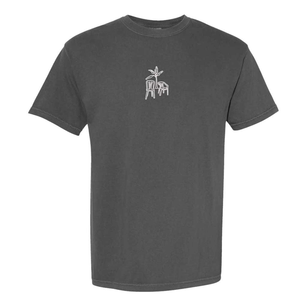 Dark heather gray Comfort Colors washed oversized t-shirt by DSY Lifestyle featuring a minimalist white DTMF embroidery of a platano tree and two chairs on the front.