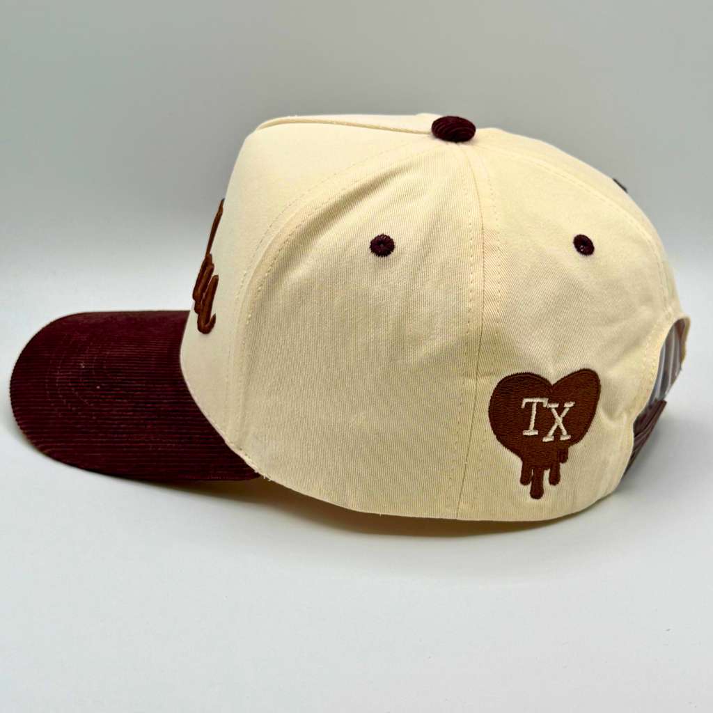 Beige and brown cap with heart-shaped &