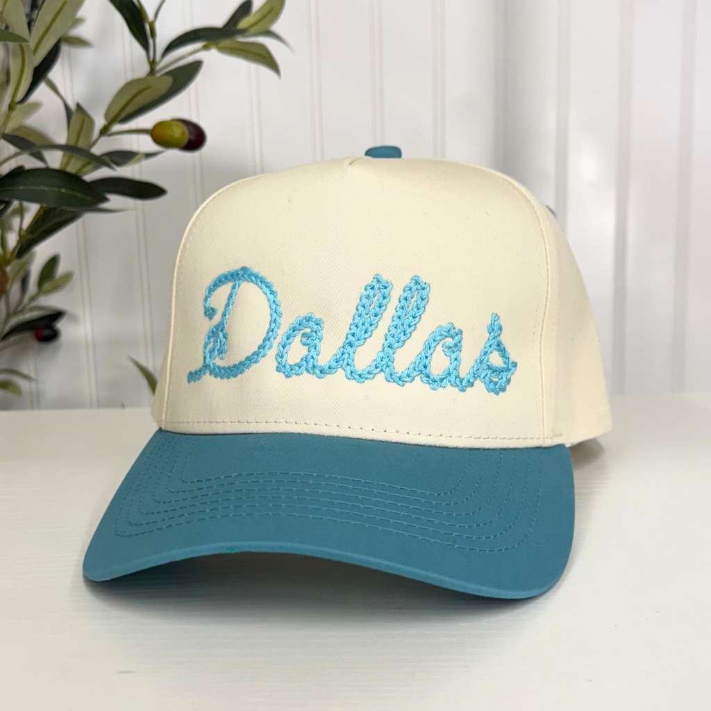 Spring 5 panel hat that has Dallas embroidered in a chain stitch. The hats is Natural Crown with Aqua bill for Spring Fashion - DSY Lifestyle