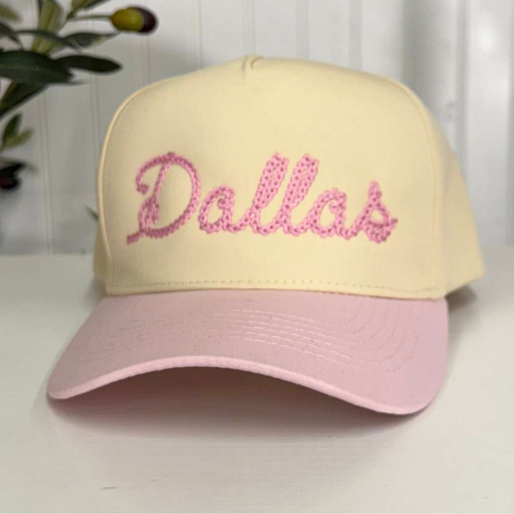 Spring 5 panel hat that has Dallas embroidered in a chain stitch. The hats is Natural Crown with Pink bill for Spring Fashion - DSY Lifestyle