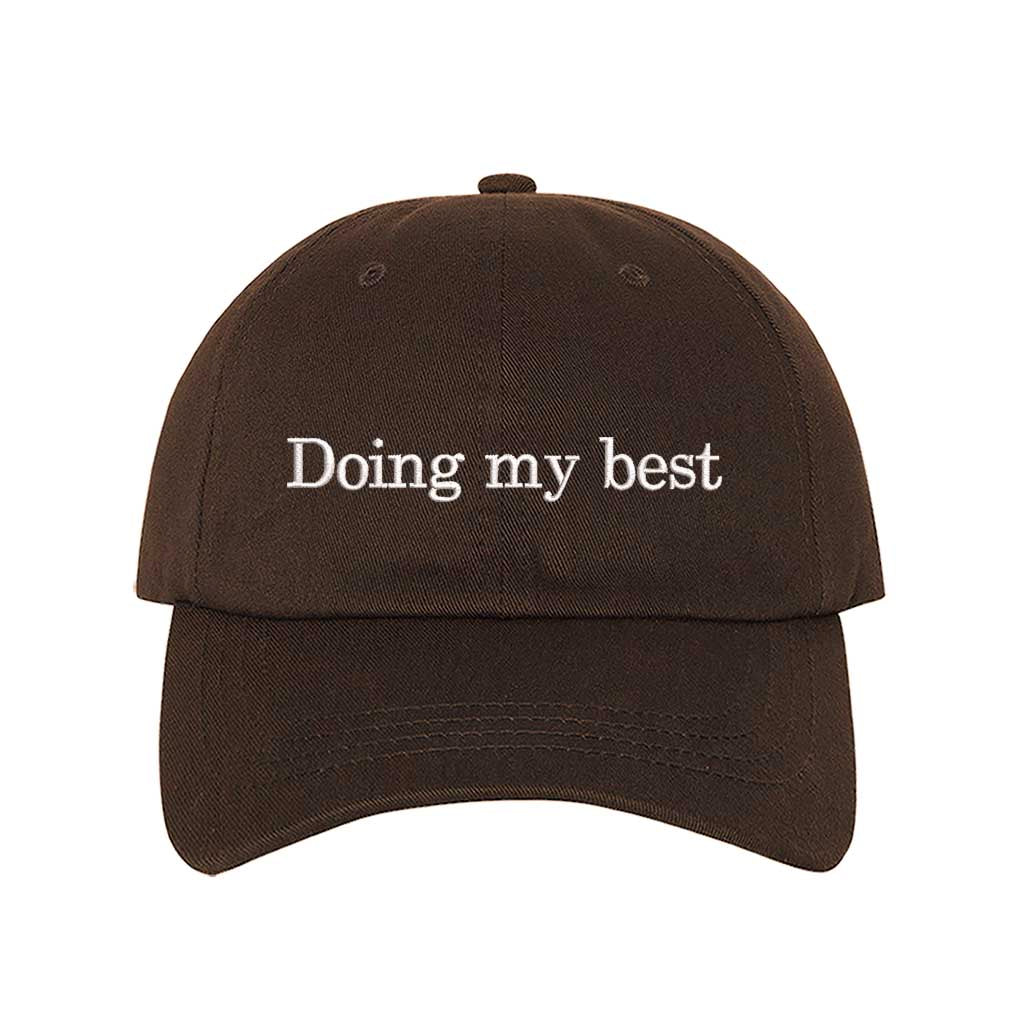 Brown close-up view of a DSY Lifestyle cotton baseball hat featuring the words Doing My Best in detailed professional embroidery. - DSY Lifestyle