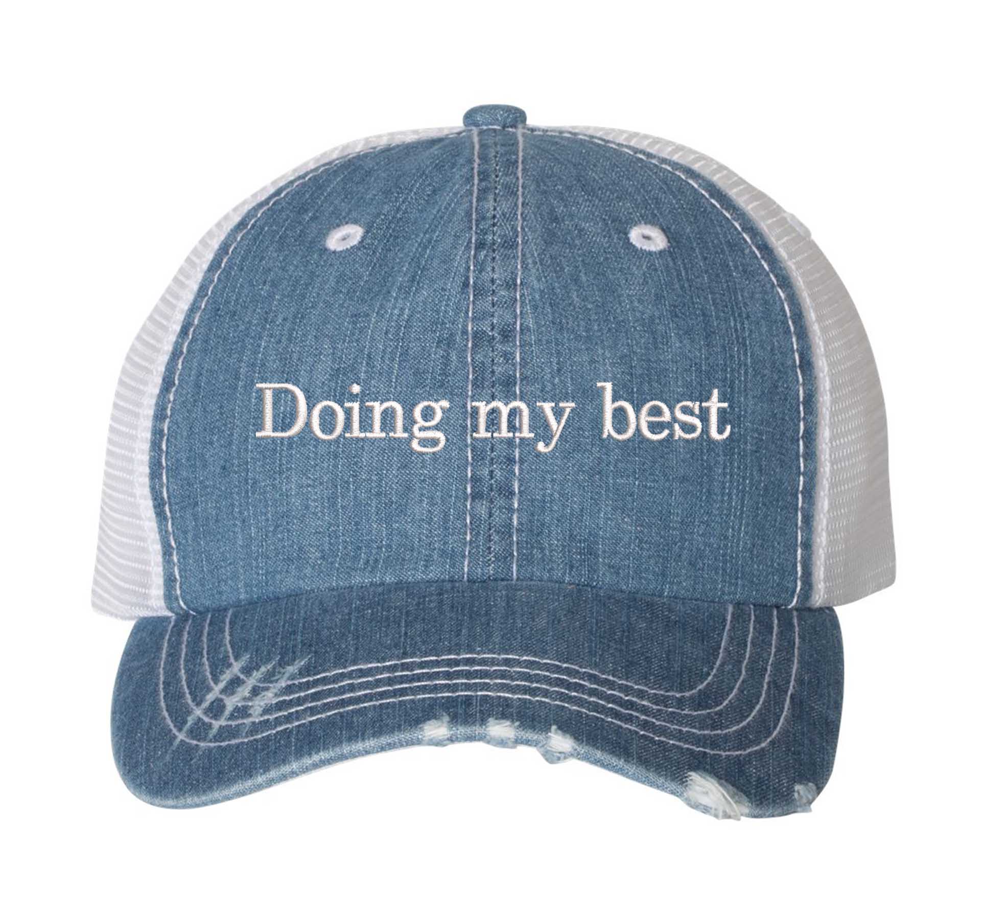 Denim Doing My Best Distressed Trucker Hat. This premium vintage-style cap is the perfect gift for the unapologetically bold, featuring a breathable mesh back and custom embroidery. - DSY Lifestyle