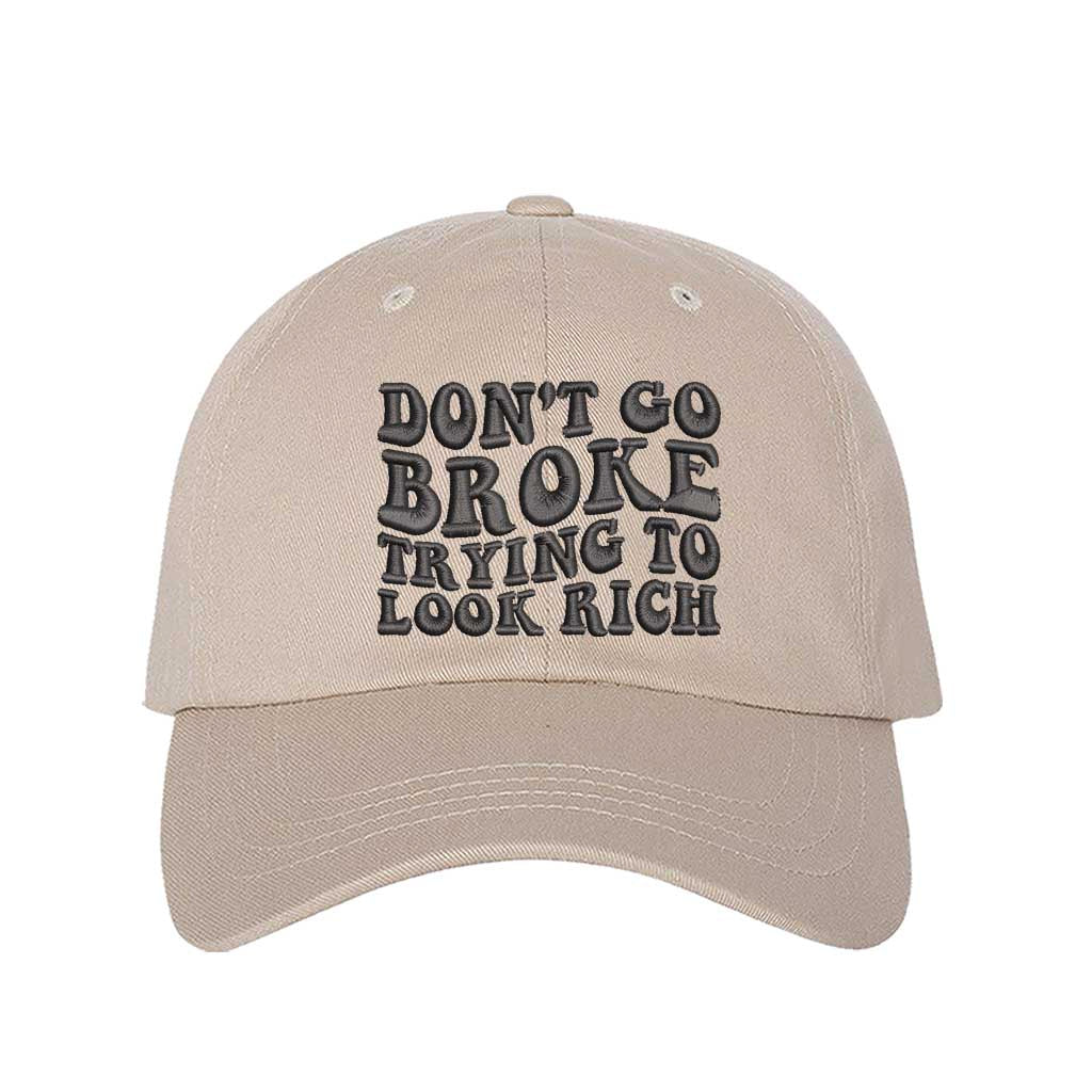Stone Don’t Go Broke Trying to Look Rich Embroidered Baseball Hat in soft cotton with curved brim and hook and loop closure. DSY Lifestyle.
