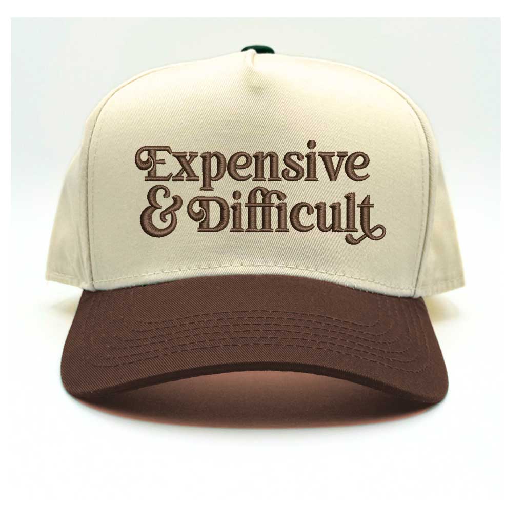 5 panel Natural color with brown bill baseball hat embroidered with the phrase Expensive & Difficult -DSY Lifestyle