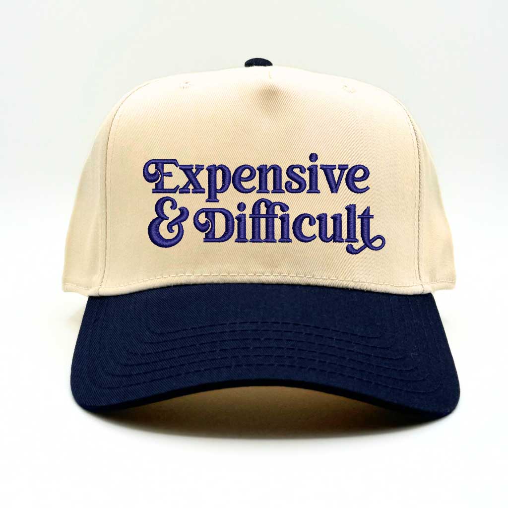 5 panel Natural color with Navy Blue bill baseball hat embroidered with the phrase Expensive & Difficult -DSY Lifestyle