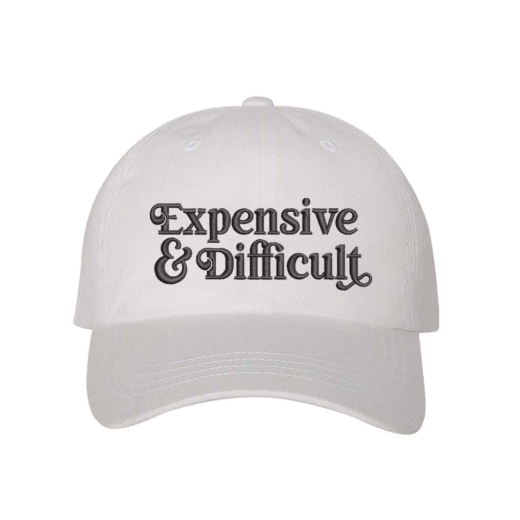 White baseball hat embroidered with the phrase expensive and difficult-DSY Lifestyle