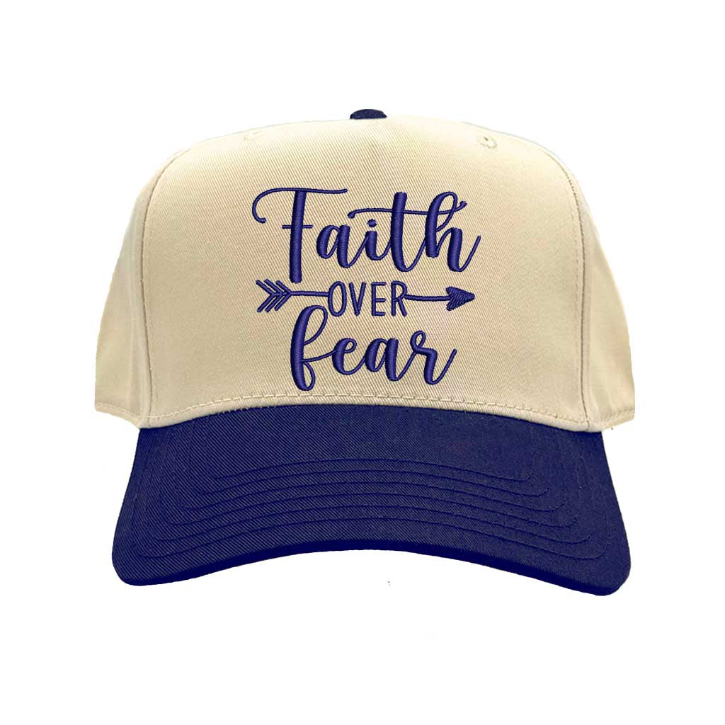 Natural Navy Blue close-up view of a DSY Lifestyle two-tone baseball hat with a neutral crown and contrast bill, featuring the words Faith Over Fear in bold, detailed embroidery. - DSY Lifestyle