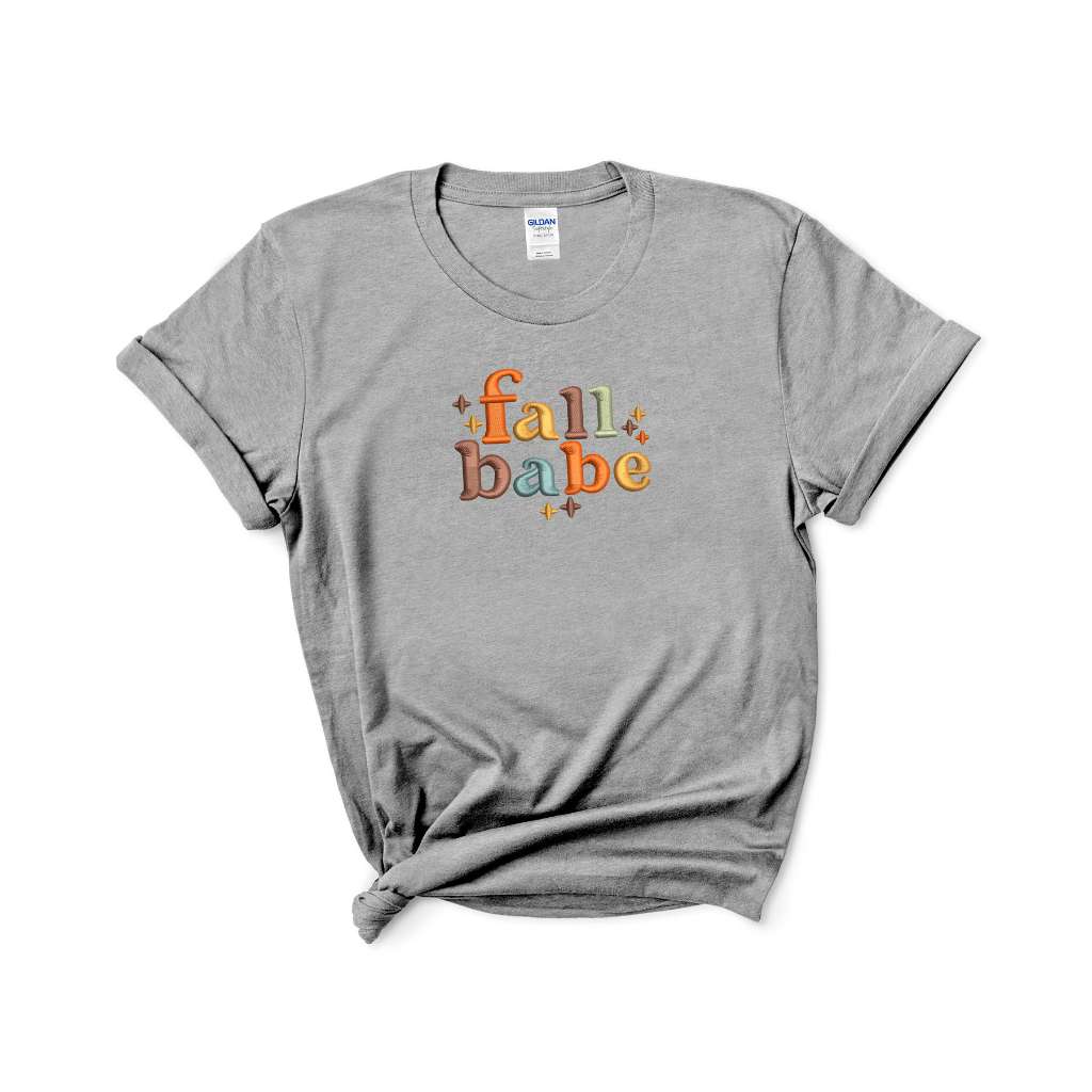 Female wearing a heather gray t-shirt embroidered with Fall Babe - DSY Lifestyle