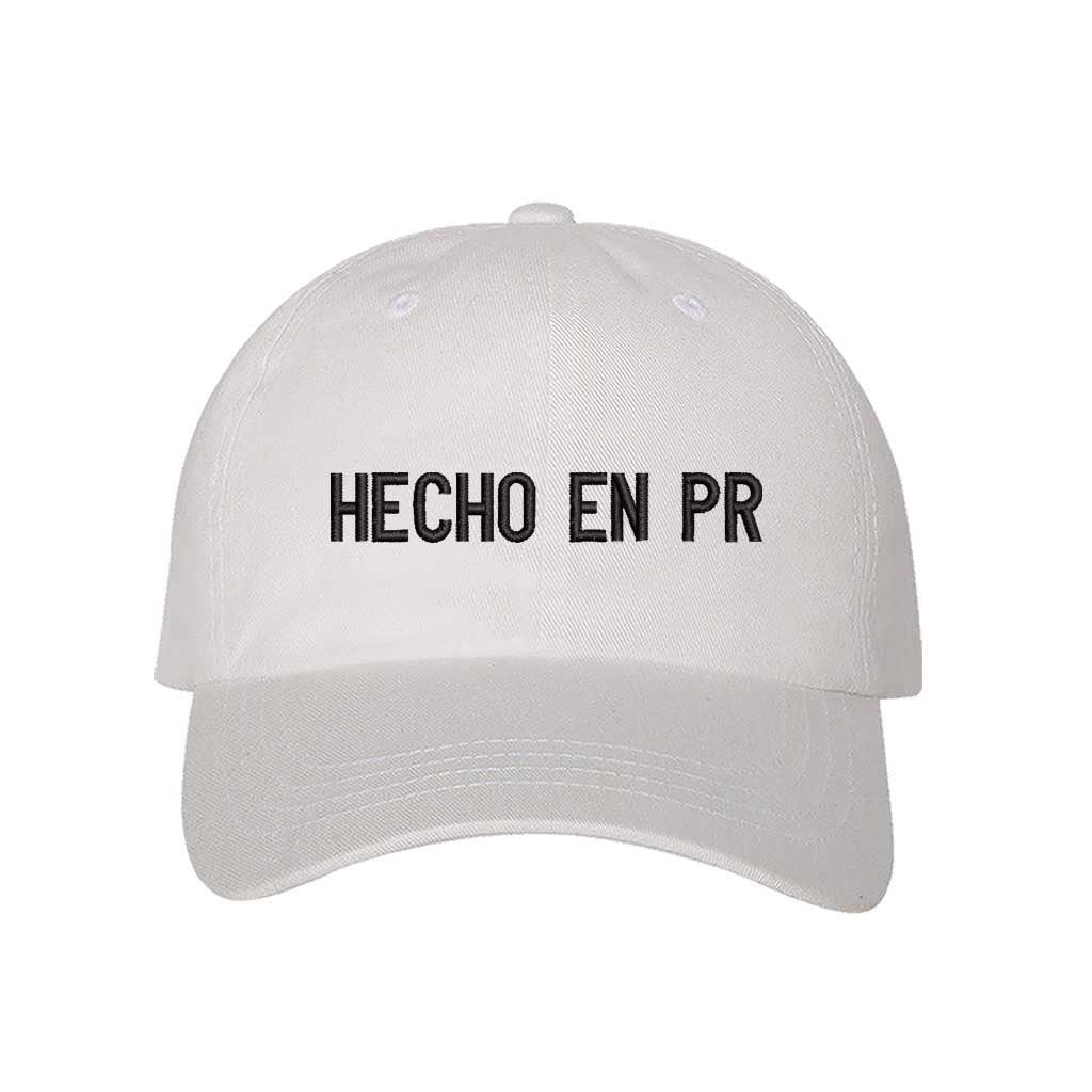 White embroidered baseball hat with "Hecho En PR" stitched in bold lettering, representing Puerto Rican pride and heritage - DSY Lifestyle