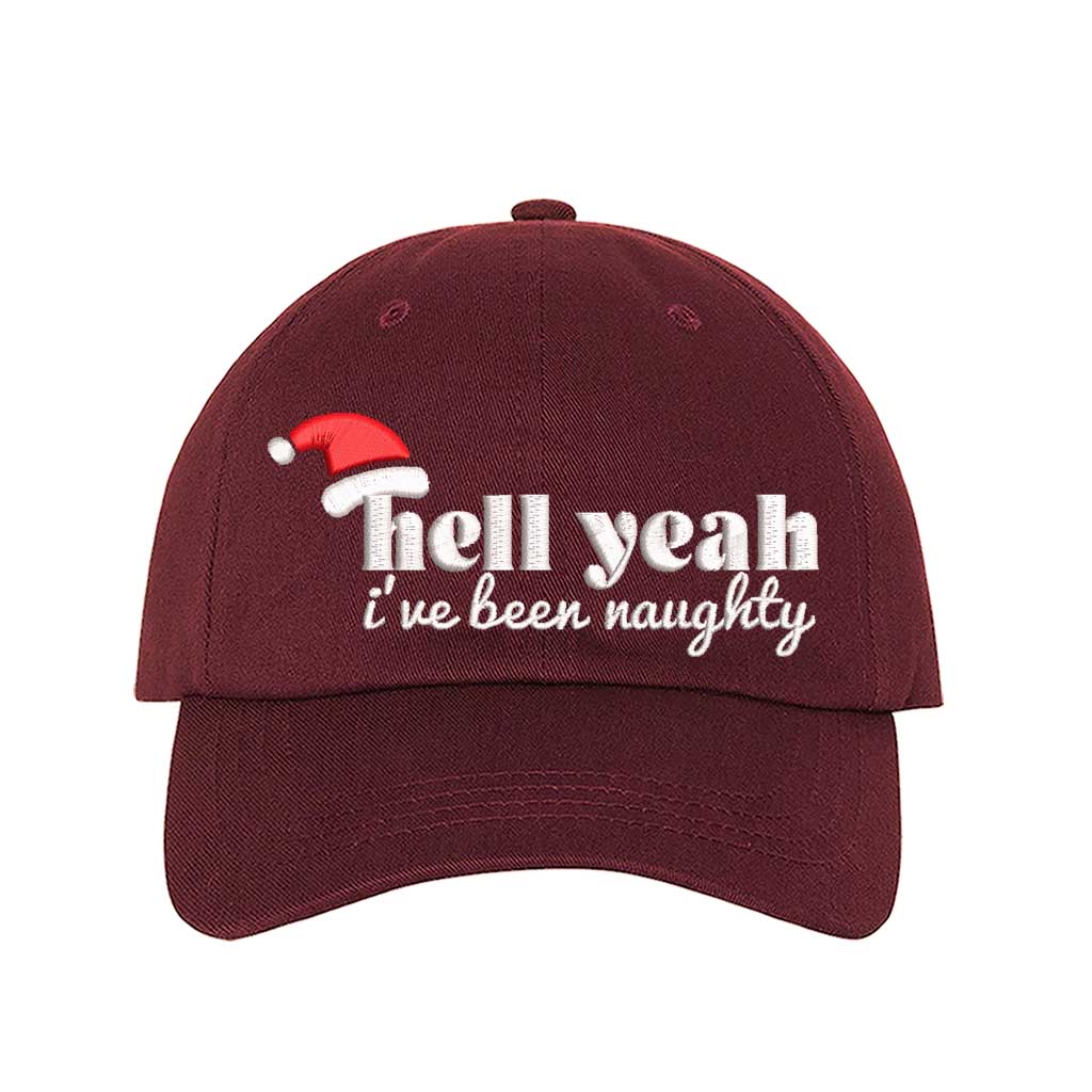 Burgundy Hell Yeah I’ve Been Naughty Embroidered Baseball Hat featuring bold statement embroidery, curved brim, and adjustable hook and loop closure – DSY Lifestyle
