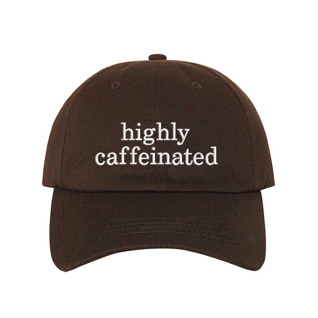 Brown cotton baseball hat featuring the phrase Highly Caffeinated in bold, crisp white embroidery. - DSY Lifestyle
