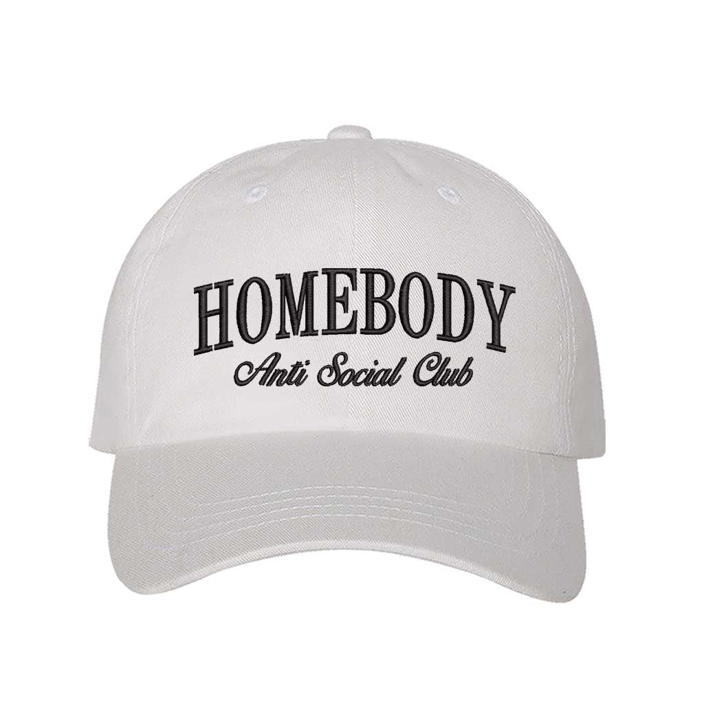 White Homebody Anti Social Club embroidered baseball hat with minimalist Black text on a premium dark cotton cap by DSY Lifestyle.