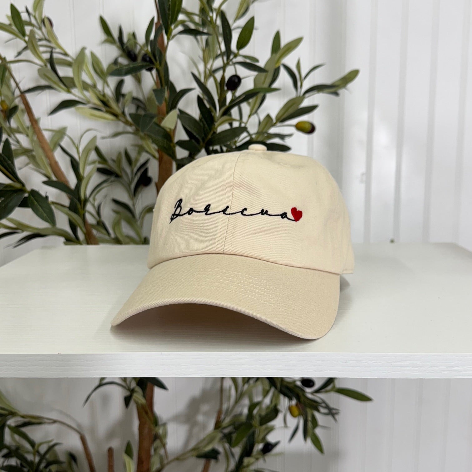 Stone embroidered baseball hat with "Boricua" stitched in cursive and a small heart accent, symbolizing Puerto Rican pride and love - DSY Lifestyle