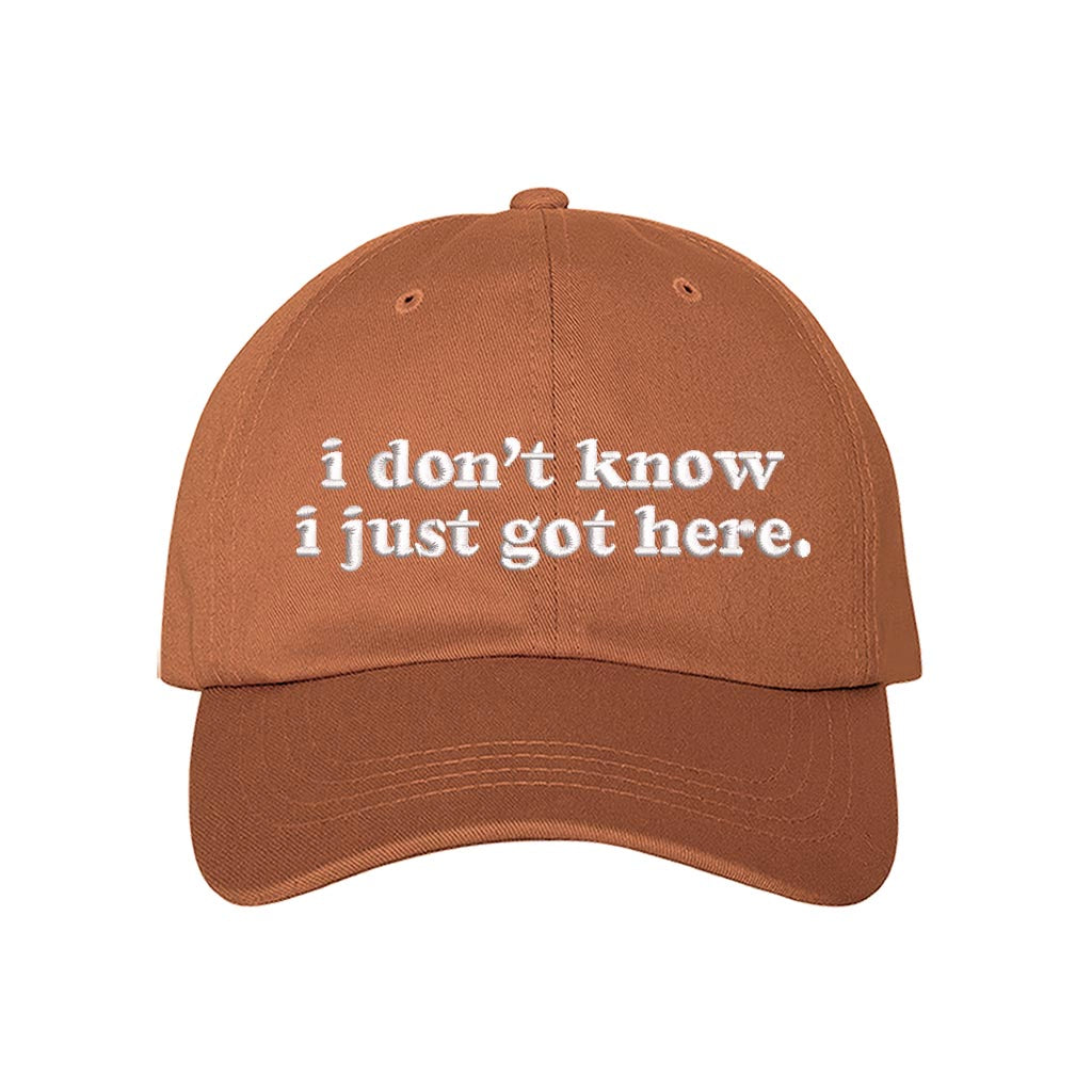 Burnt Orange baseball hat embroidered with the phrase i dont know i just got here-DSY Lifestyle