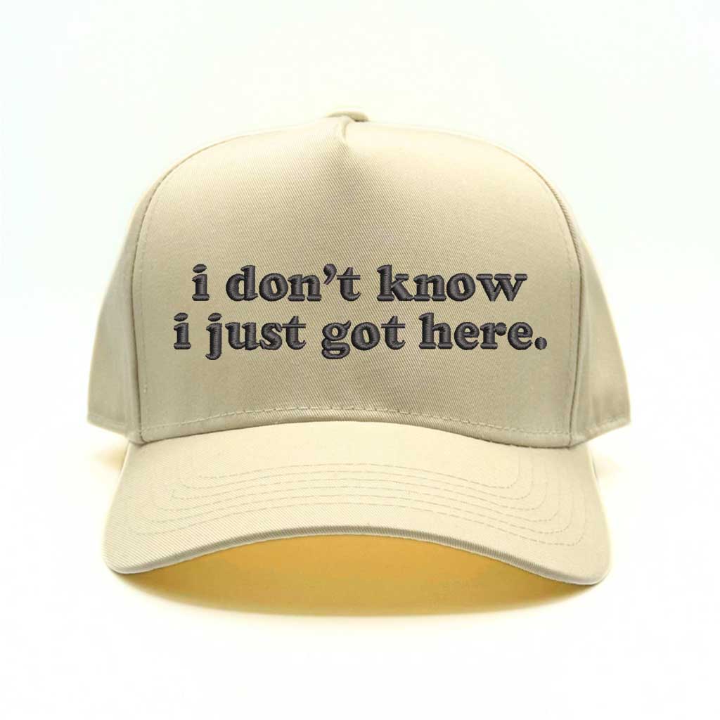 Natural baseball hat with natural colored bill and the phrase i don&