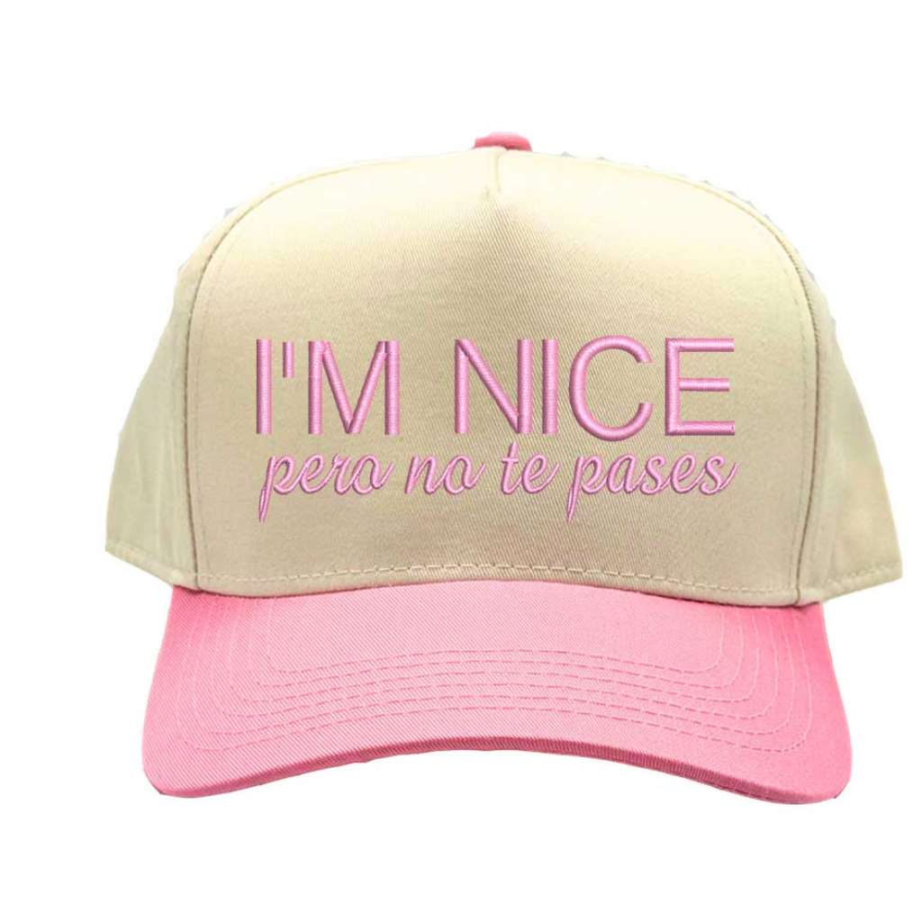 Beige and pink cap with text on a white background