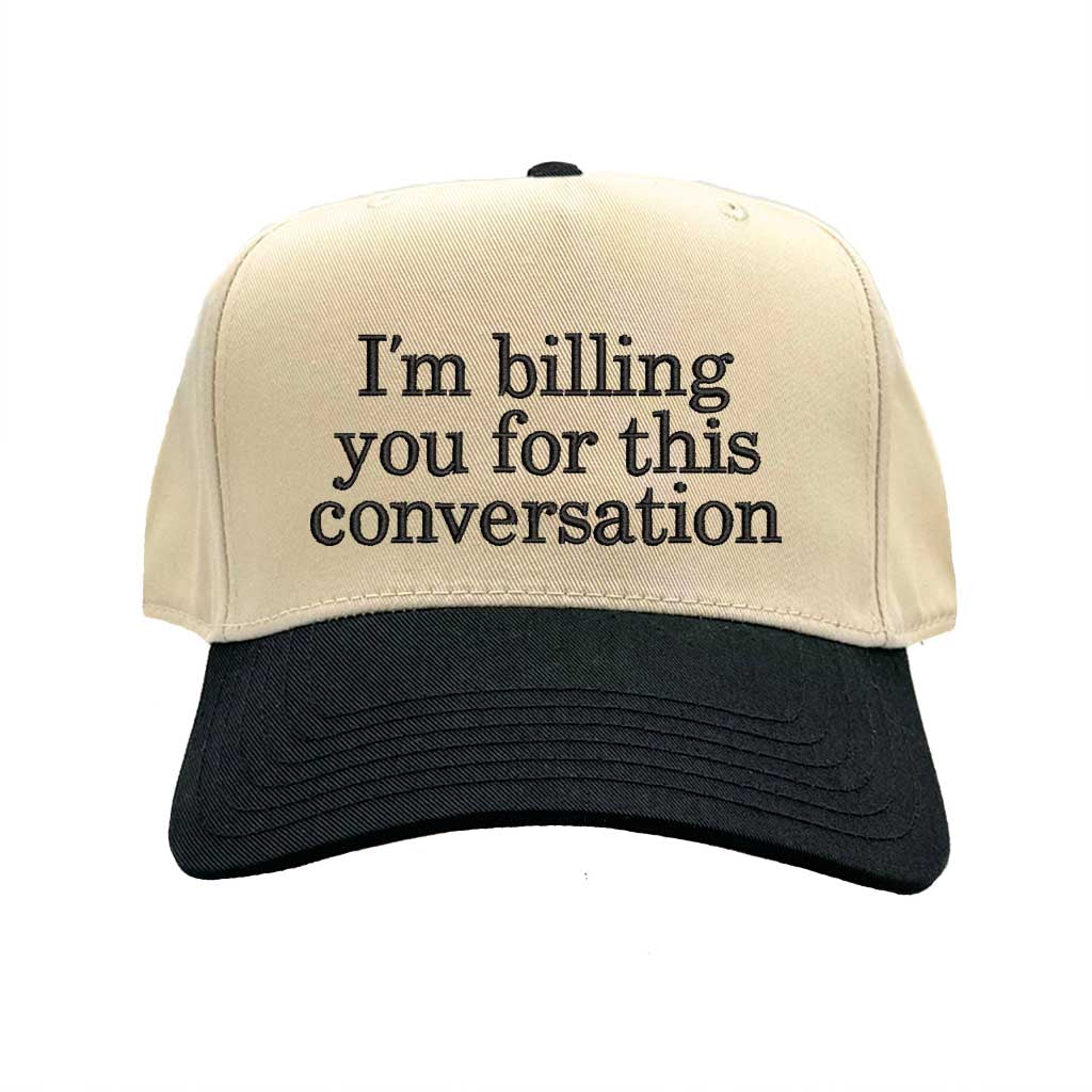 Beige and black cap with text &