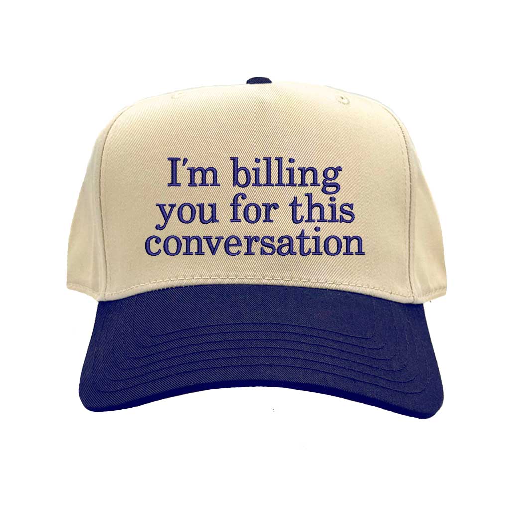Beige and navy cap with text &