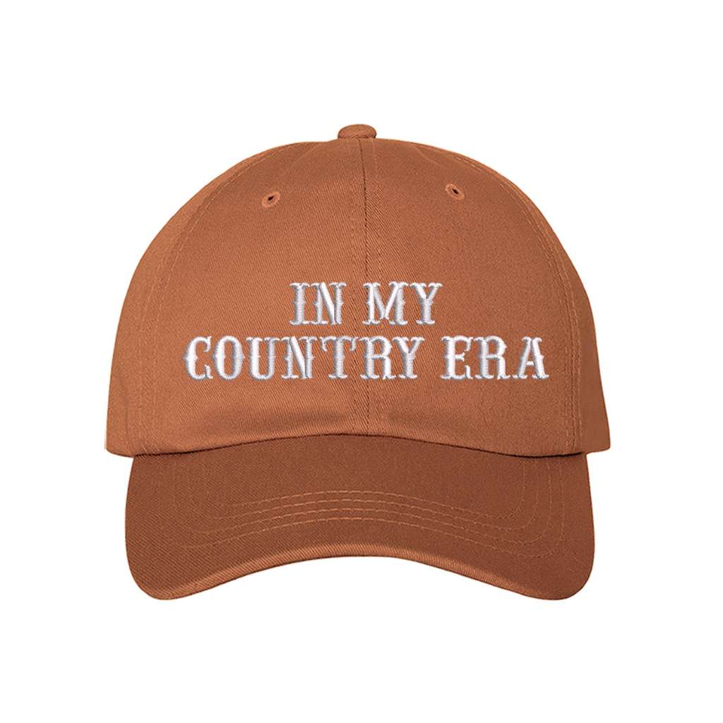 Burnt Orange Baseball hat thats embroidered with the phrase in my country era on the front-DSY Lifestyle
