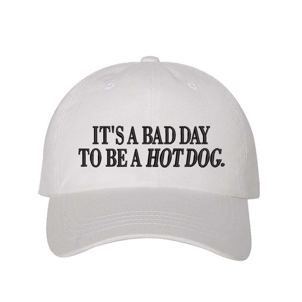 White embroidered baseball hat with the phrase “It’s a Bad Day to Be a Hotdog” — perfect for BBQs and summer parties. - DSY Lifestyle