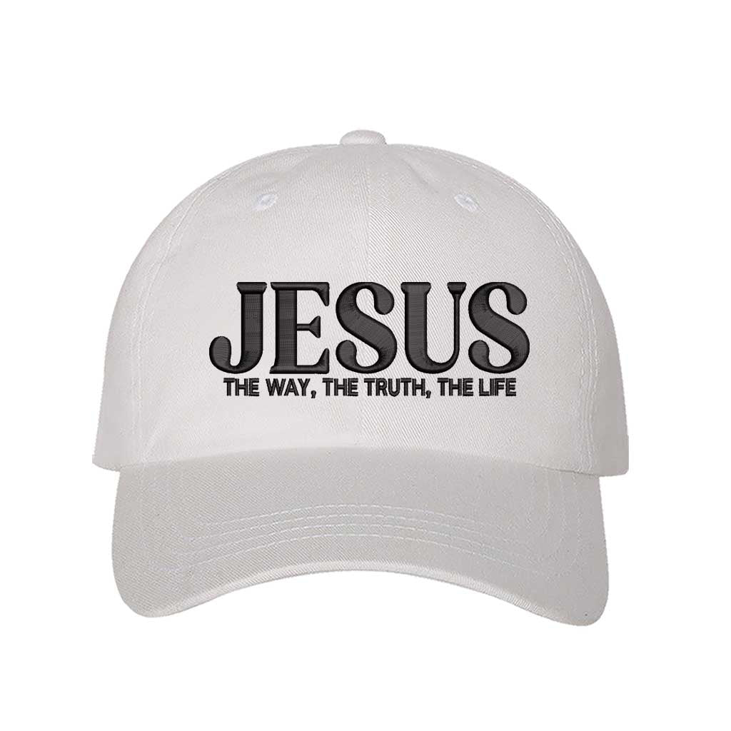 White Jesus The Way The Truth The Life 3D Puff Baseball Hat featuring bold black 3D raised embroidery on a structured cotton cap; a premium scripture statement piece by DSY Lifestyle.