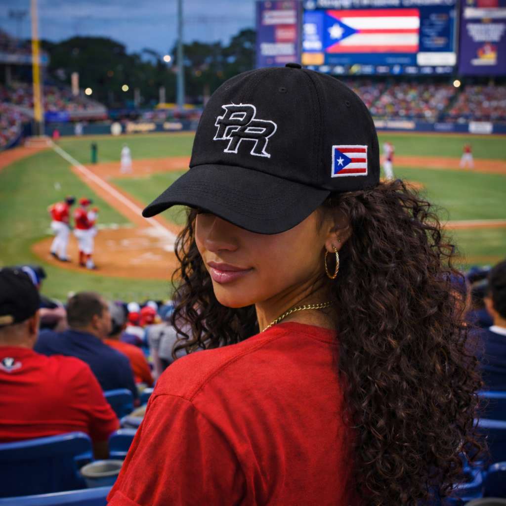 Woman wearing a black cap with a PR 3D embroidery and Puerto Rican flag at a Puerto Rico Team baseball game.