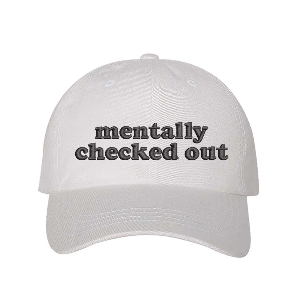 White cotton baseball hats with the phrase Mentally Checked Out embroidered black thread in a clean, modern font. - DSY Lifestyle