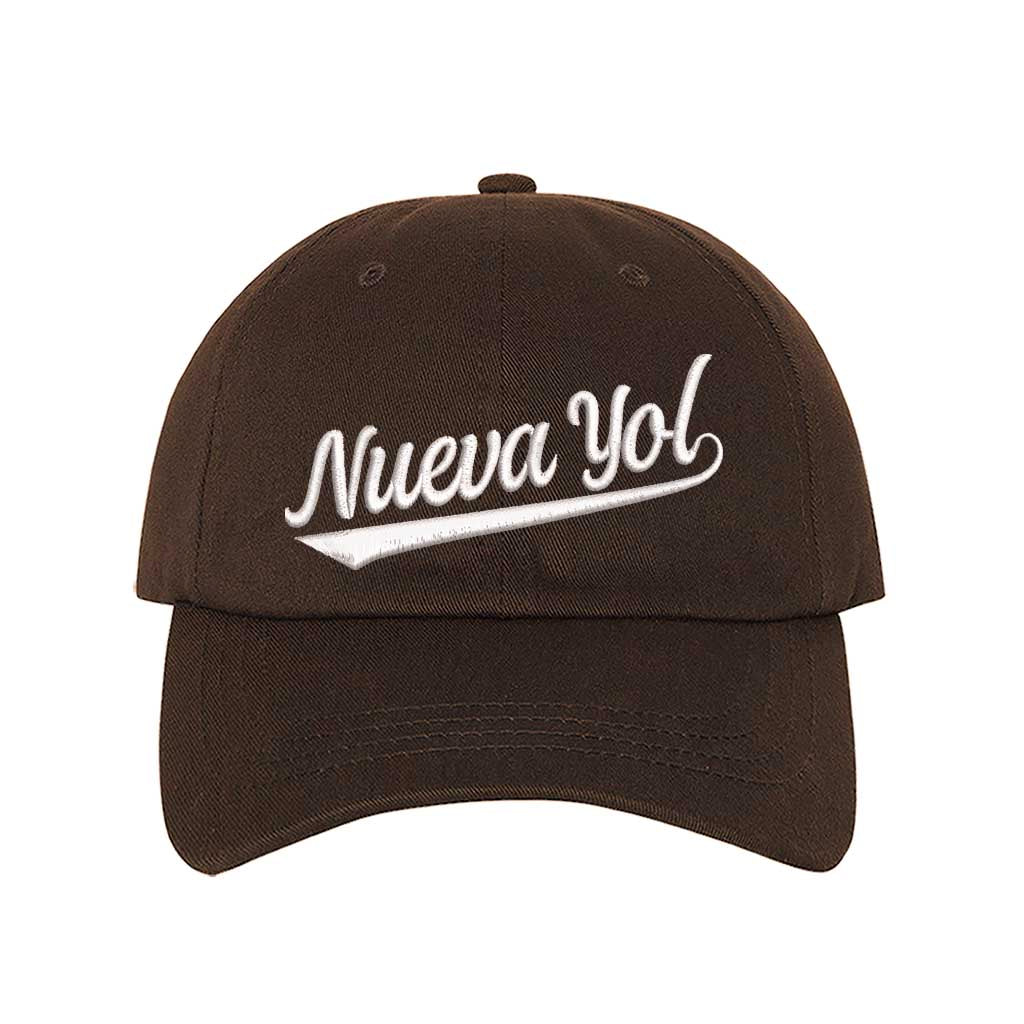 Brown detailed close-up of the premium thread embroidery showing the clean lines of the Nueva Yol text on textured fabric. - DSY Lifestyle