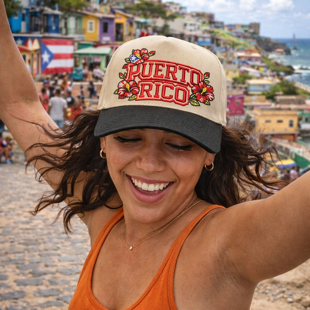 Female happy in the city wearing a Natural Black Puerto Rico in Bloom embroidered baseball hat. A two-tone statement hat for women who love culture, effortless outfits, and bold style. - DSY Lifestyle