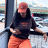 Female wearing a tshirt embroidered with Pumpkin Spice and a burnt orange baseball hat embroidered with Scorpio Zodiac Sign - DSY Lifestyle