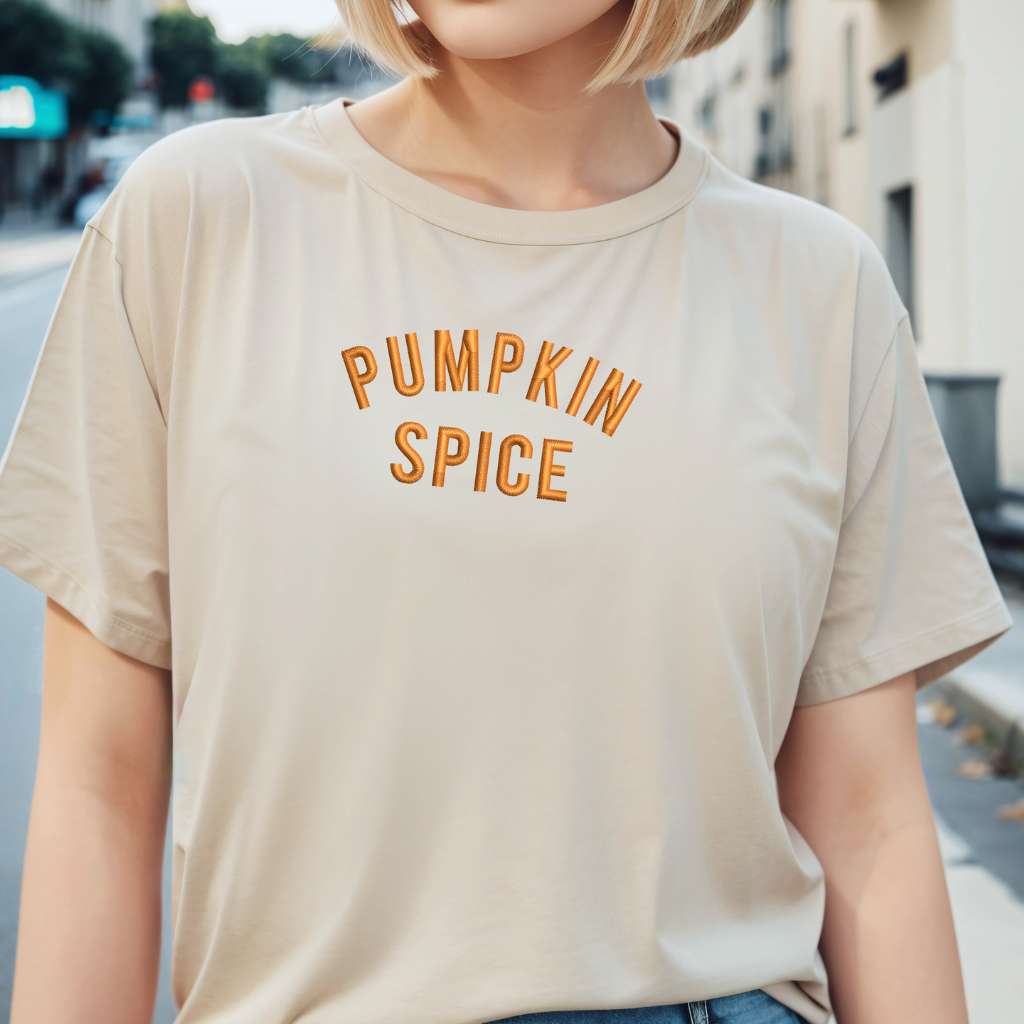 Female wearing a Khaki T-shirt embroidered with Pumpkin Spice - DSY Lifestyle