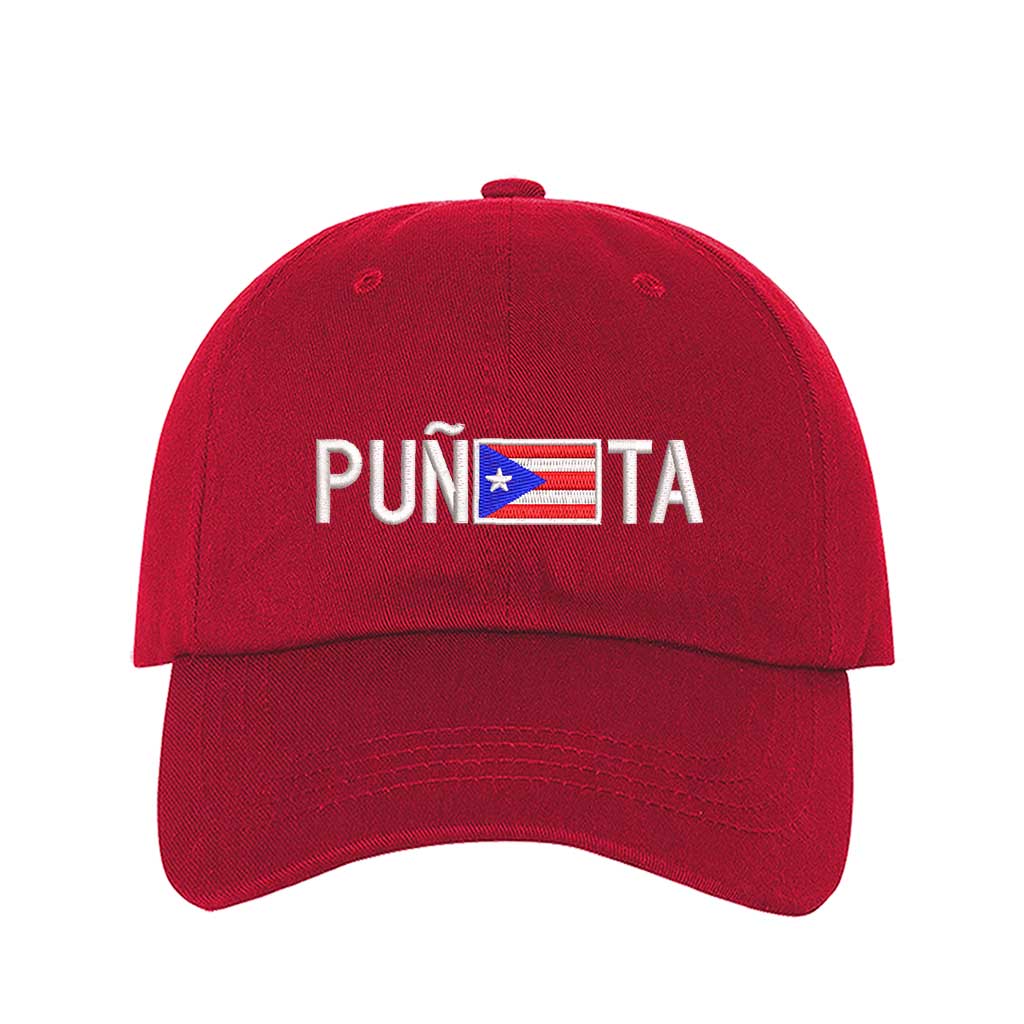 Red embroidered baseball hat with "Puñeta" in bold lettering, featuring the Puerto Rican flag as the letter "E," representing Boricua pride and culture - DSY Lifestyle