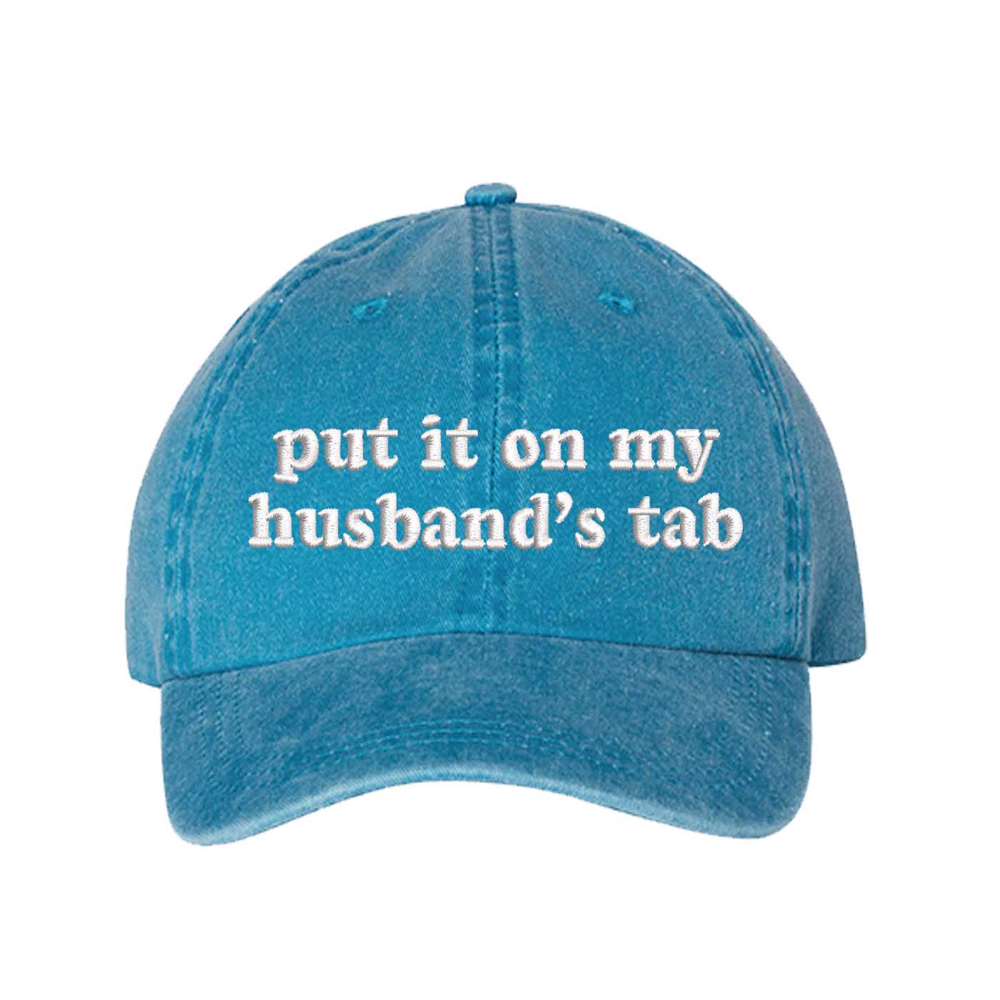 Turquoise Put It On My Husband’s Tab washed cotton baseball hat with a soft finish and high-density white embroidery by DSY Lifestyle. - DSY Lifestyle