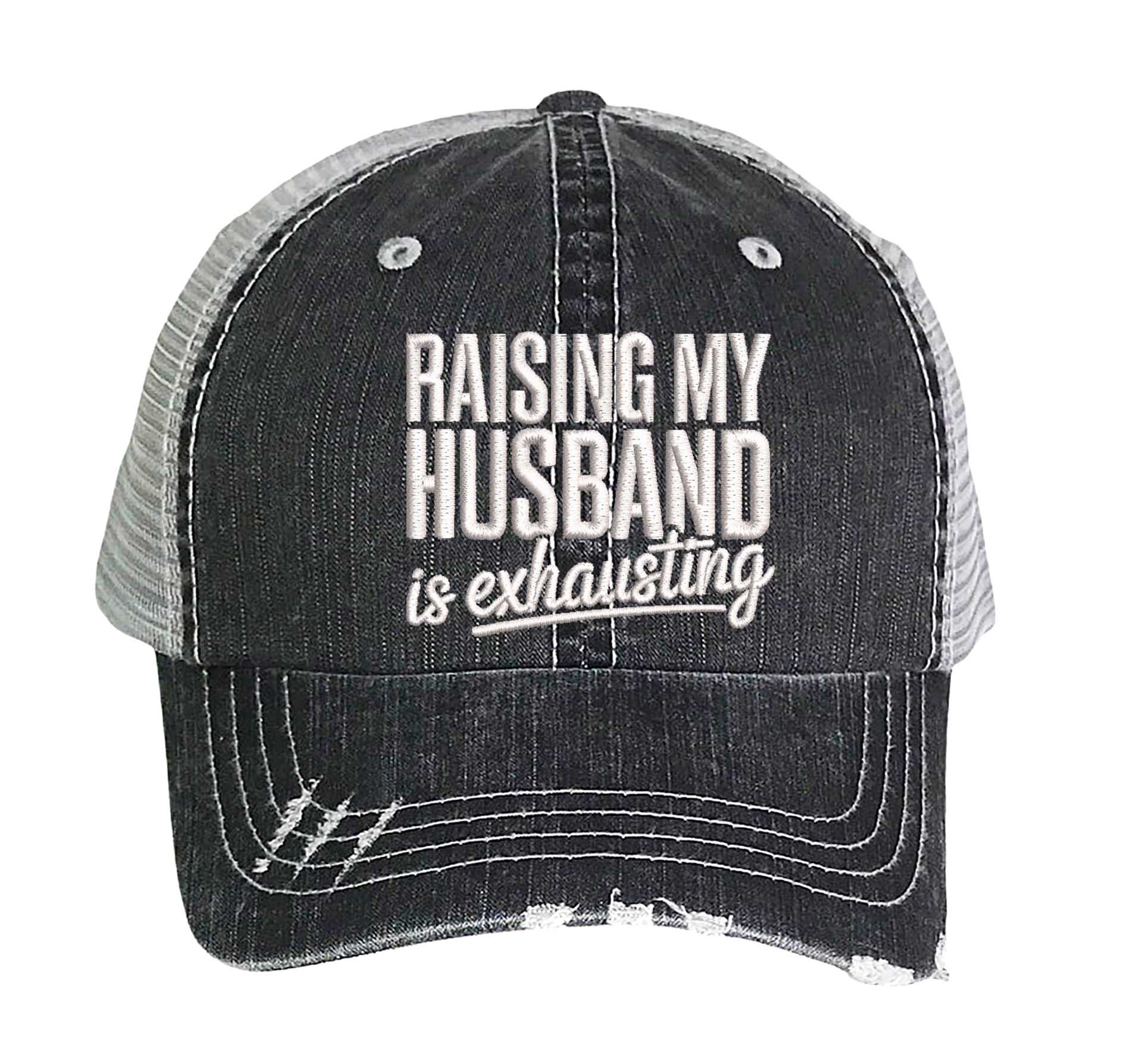 Black DSY Lifestyle distressed trucker hat featuring the phrase Raising My Husband Is Exhausting in bold, professional embroidery. - DSY Lifestyle