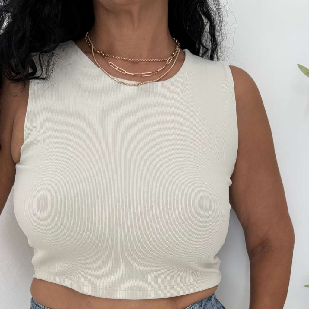 Woman wearing a Sleeveless Knit Crop Top in white - DSY Lifestyle