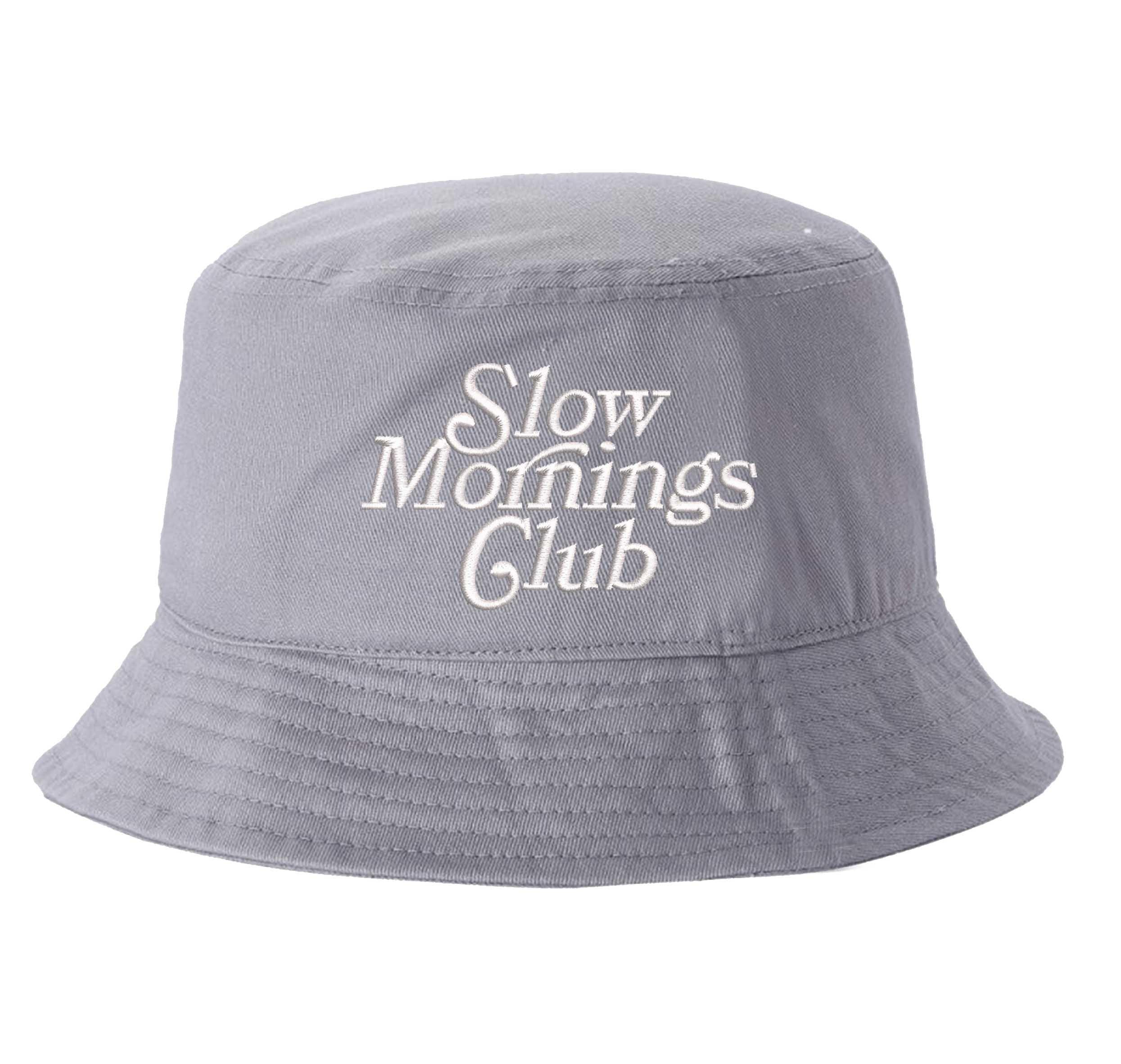 Gray Front view of a classic cotton bucket hat featuring the phrase "Slow Morning" in high-density script embroidery. - DSY Lifestyle