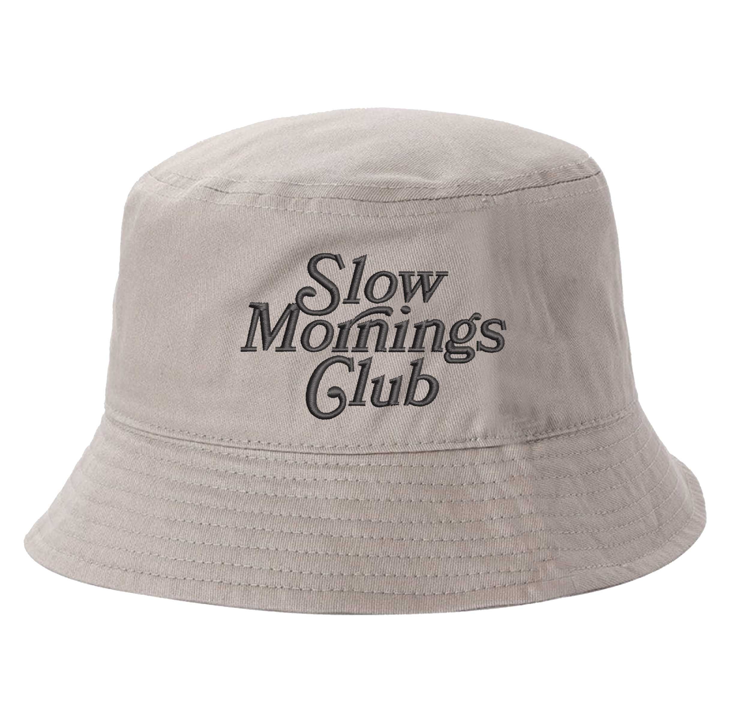 Khaki Front view of a classic cotton bucket hat featuring the phrase "Slow Morning" in high-density script embroidery. - DSY Lifestyle